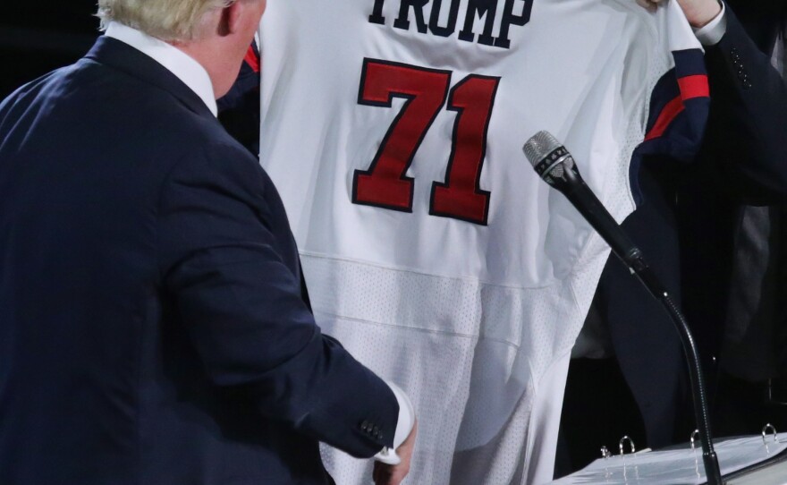 Liberty University President Jerry Falwell Jr. presents Republican presidential candidate Donald Trump with a sports jersey after Trump delivered the convocation last week.