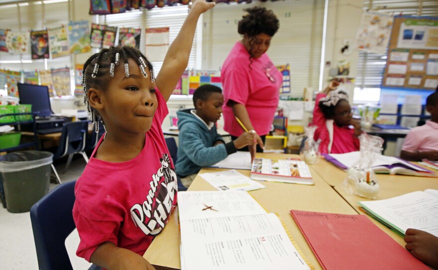 Walton Elementary second-grader Janiya Smith asks to be called on at the Jackson, Miss., school. Voters in the state rejected an initiative to increase funding for Mississippi's public schools.