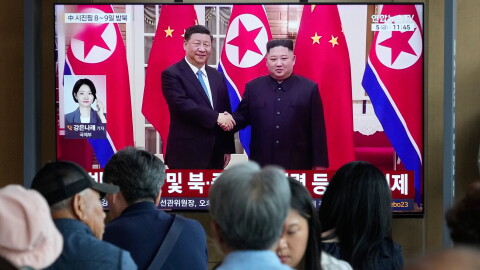 People watch a TV screen showing a file image of North Korean leader Kim Jong Un, right, and Chinese President Xi Jinping, at the Seoul Railway Station in Seoul, South Korea, Friday, June 5, 2026.