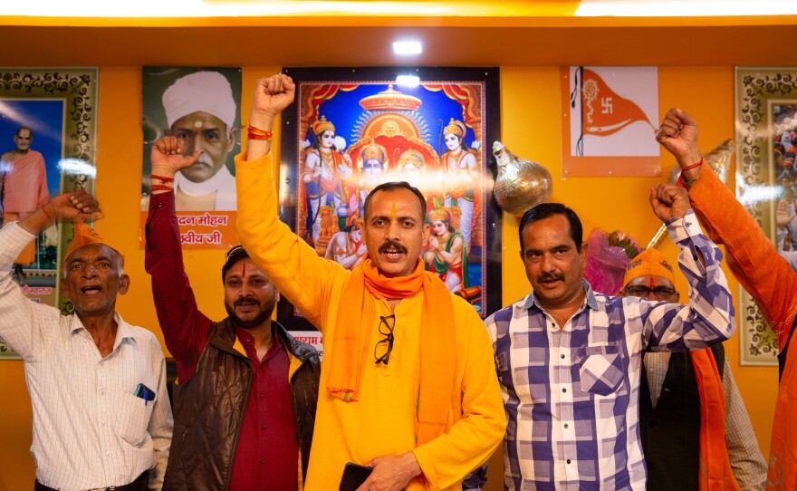 Pankaj Tiwari (center), 47, chants Hindu nationalist slogans with fellow members of the Hindu Mahasabha, a far-right extremist group, at their office in Lucknow, the capital of India's Uttar Pradesh state. Tiwari is the group's local Lucknow leader.