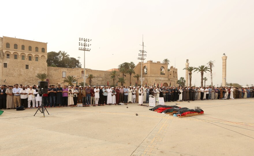 Mourners gather for funeral prayers for fighters killed by warplanes of Khalifa Haftar's forces on April 24 in Tripoli, Libya.