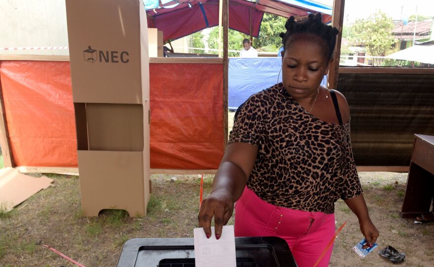 A woman casts her ballot at a polling station in Monrovia, Liberia, as Liberians go to the polls for the second round of presidential elections on Tuesday.