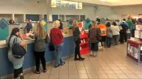 People wait in line at the United States Postal Service's Margaret L. Sellers Processing and Distribution Center in Carmel Mountain, Dec. 18 2017.