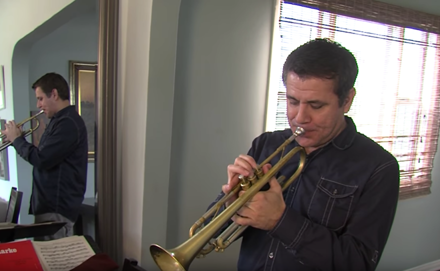 Gilbert Castellanos plays the trumpet in his Normal Heights home, Feb. 20, 2017.