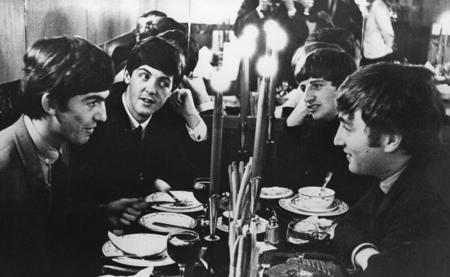 The Beatles, dining together in London in 1963.