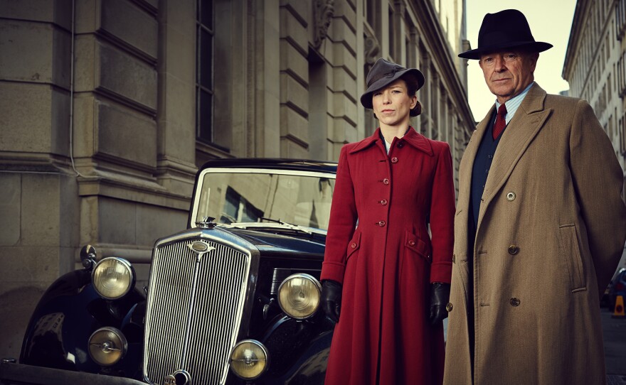 A scene from FOYLE'S WAR Season 8: DCS Christopher Foyle (Michael Kitchen on right) and Sam Wainwright (Honeysuckle Weeks on left)