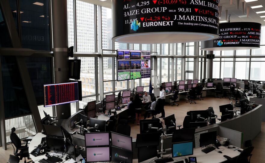 Screens show plunging stocks at the Euronext Stock Exchange services in Paris on Friday, as Britain votes to leave the European Union, fueling a wave of global uncertainty.