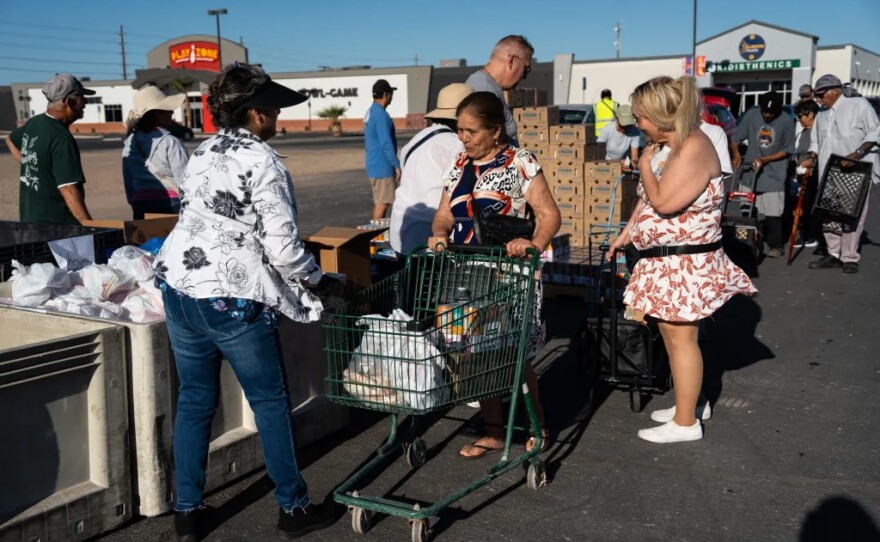 Imperial County residents receive food from the Imperial Valley Food Bank in El Centro, Calif. on May 9, 2025. 