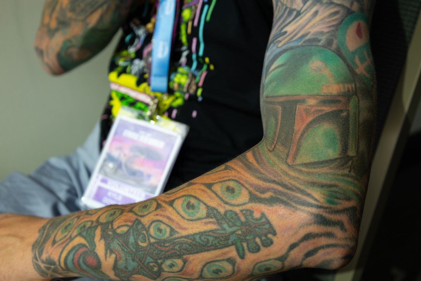 A Star Wars-themed tattoo sleeve featuring Boba Fett is flexed at Comic-Con, July 24, 2026.
