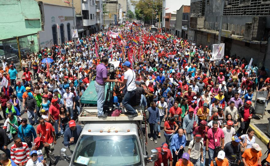 Supporters of Venezuelan President Nicolas Maduro march in the capital on Wednesday.