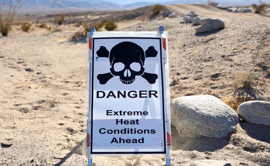 A sign reads "Danger Extreme Heat Conditions Ahead" in Anza-Borrego Desert State Park, which is threatened by climate change, on March 23 near Borrego Springs, Calif.