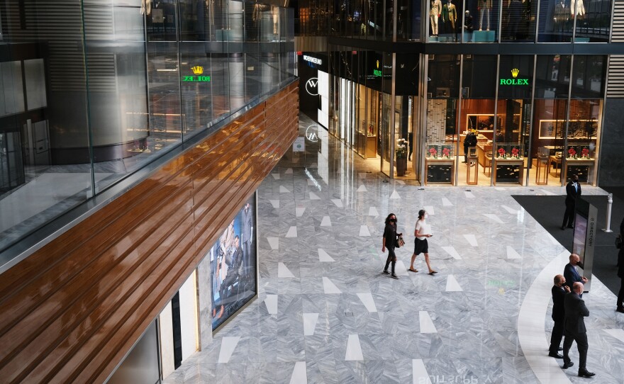 People walk through the newly reopened mall at Hudson Yards in New York. U.S. shoppers spent more prudently in August and retail sales grew a tepid 0.6% from July.