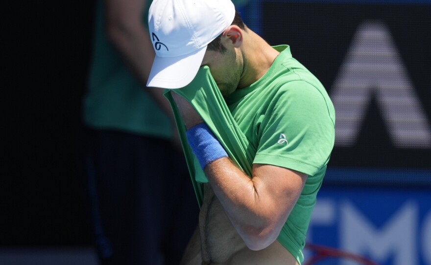 Defending men's champion Novak Djokovic practices at Margaret Court Arena ahead of the Australian Open tennis championship in Melbourne, Australia, on Jan. 13, 2022.