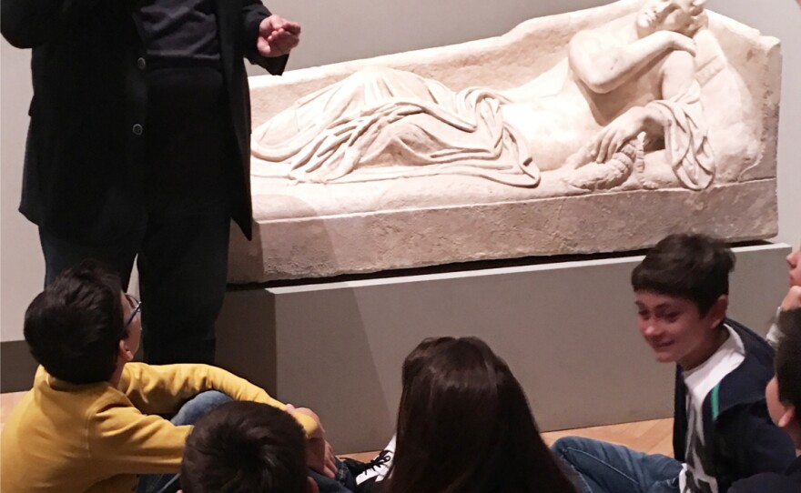 Lt. Sebastiano Antoci tells a fifth grade class visiting Rome's Palazzo Barberini museum how the art squad rescued an ancient statue.