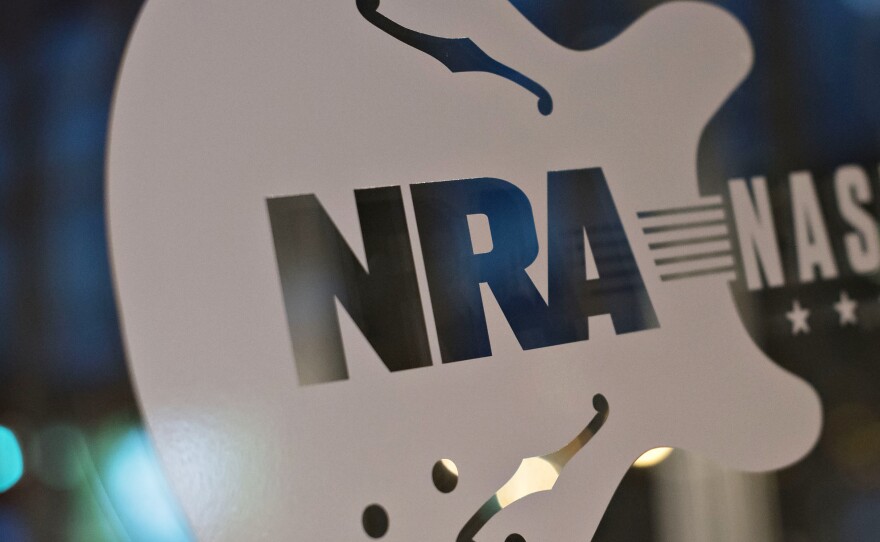 A sign touts the 144th National Rifle Association annual meetings and exhibits. The NRA may have more Russian or foreign members than it first acknowledged.