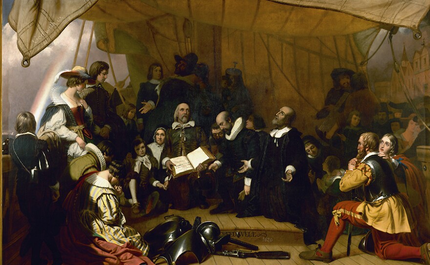 John Robinson leading Pilgrim families in prayer aboard the Speedwell at Holland.