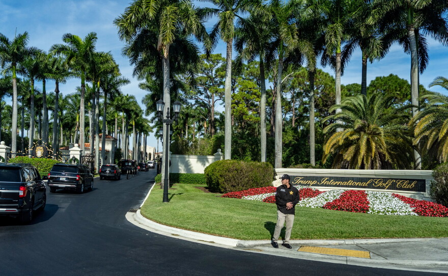 FILE - The motorcade for President Donald Trump arrives at Trump International Golf Club, Jan. 2, 2026, in West Palm Beach, Fla.
