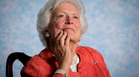 In this file photo from Friday, March 18, 2005, former first lady Barbara Bush listens to her son, President George W. Bush, as he speaks on Social Security reform in Orlando, Fla.