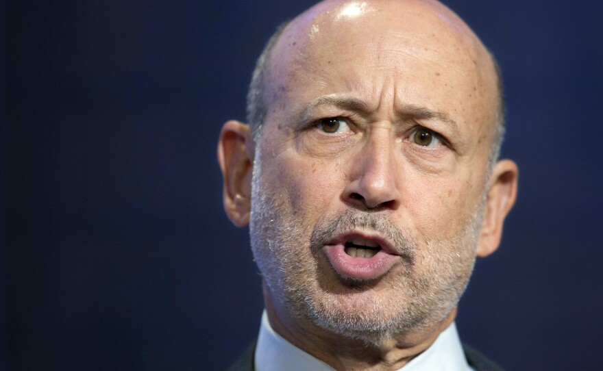 Goldman CEO Lloyd Blankfein, shown here at a September 2014 panel discussion, says he is pleased to resolve the allegations against the firm.