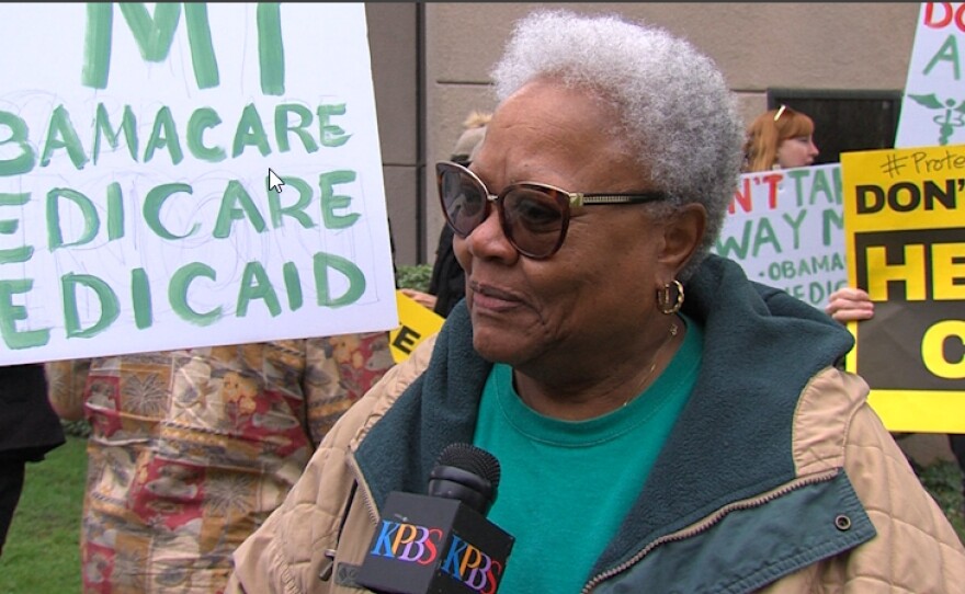 Vista resident Marjorie Bramwell protesting at Cong. Darrell Issa's Vista office, Jan. 12, 2017.