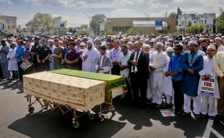 Thousands gather to pray at caskets of Imam Maulama Alauddin Akonjee and Thara Uddin on Monday in New York. Both were shot as they left a mosque in Queens following afternoon prayers Saturday.
