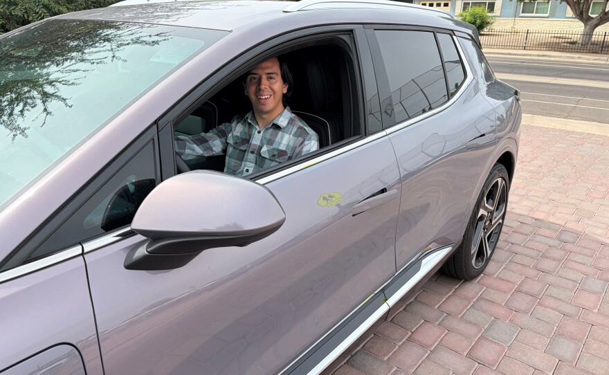 Guadalupe Higuera behind the wheel of his 2025 Chevrolet Equinox EV in Phoenix, Ariz.