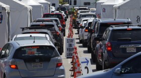 Motorists sit inside their vehicles as they wait their turn to be inoculated with a COVID-19 vaccine at the California State University, Los Angeles campus in Los Angeles, Thursday, April 8, 2021. 