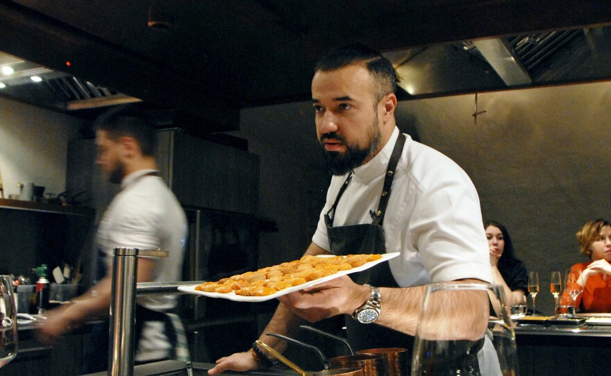 Chef Vladimir Mukhin prepares food at his Chef's Table restaurant in Moscow. Mukhin owns more than 20 restaurants, mostly in Russia, including White Rabbit.