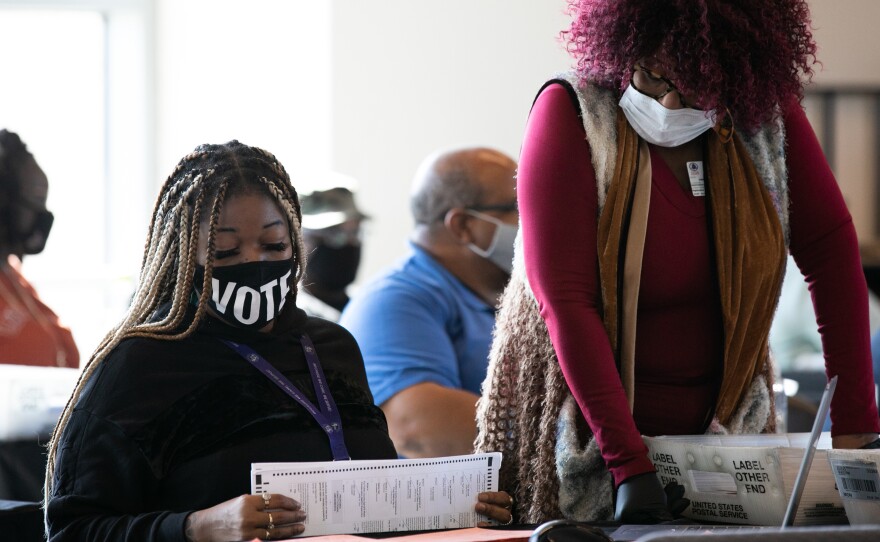 Fulton County workers count absentee ballots on Nov. 6, 2020, in Atlanta. A judge's order marks the latest challenge for the county in a seemingly never-ending election cycle.