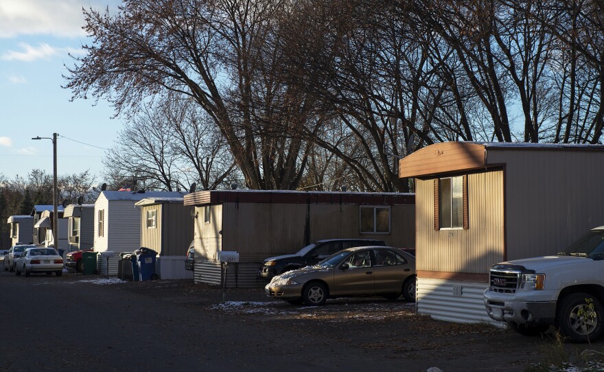 The sun illuminates a row of homes at Park Plaza Cooperative in Fridley, Minn. Five years ago, the residents formed a nonprofit co-op and bought their entire neighborhood from the company that owned it.