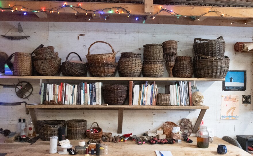 In the center of her bookshelf, Fraser keeps the urn she made to hold her grandfather's ashes before they were scattered.