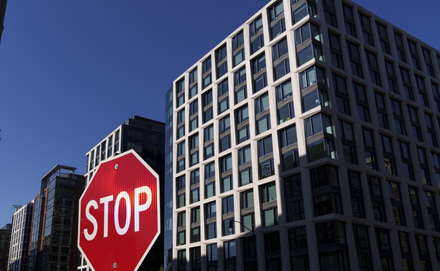 A view of The Crossing apartment building in the Navy Yard neighborhood on April 8, 2022 in Washington, DC. The building, which was raided by the FBI on April 6, is the home of two men accused of posing as federal law enforcement employees and ingratiating themselves with U.S. Secret Service agents.