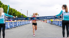 Bonnie Keating of San Diego crosses the finish line at the SDCCU OC Marathon on Sunday, May 5, 2019. She was the winner in the women's race.