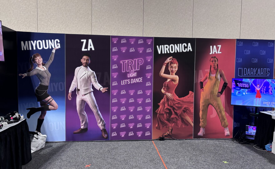 Trip the Light's booth at the Augmented World Expo included posters of the app's virtual instructors. Real-life performers, who gave Trip the Light permission to motion capture their movements, were used as a basis for these avatars.