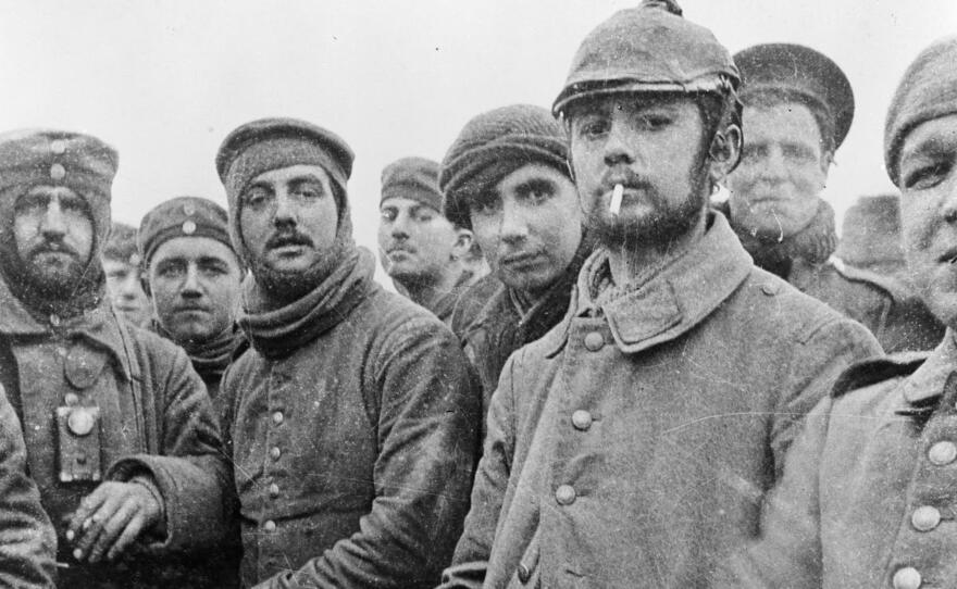 British and German soldiers fraternizing at Ploegsteert, Belgium, on Christmas Day 1914. World War I was raging at the time, but front-line troops initiated the truce, which they documented in photos and letters. Commanders on both sides were furious when they learned of it.