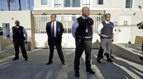 Security is tight after a car carrying Enrique Marquez Jr. arrived at U.S. District Court in Riverside, Dec. 17, 2015. 