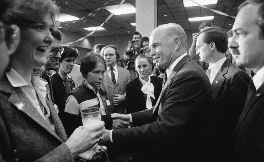 Glenn (center) shakes hands with unidentified supporters in Birmingham, Ala., on Super Tuesday, March 14, 1984. Glenn and Colorado Sen. Gary Hart were in a tight race for second place in the Alabama primary.