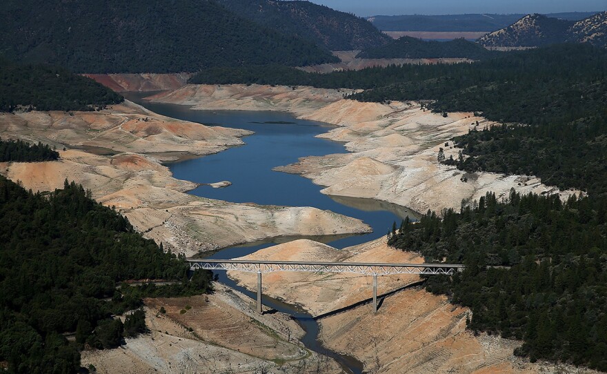 The Enterprise Bridge in Oroville, during severe drought in 2014 (left) and this April, during the week that the majority of the state's drought emergency is due to be lifted.