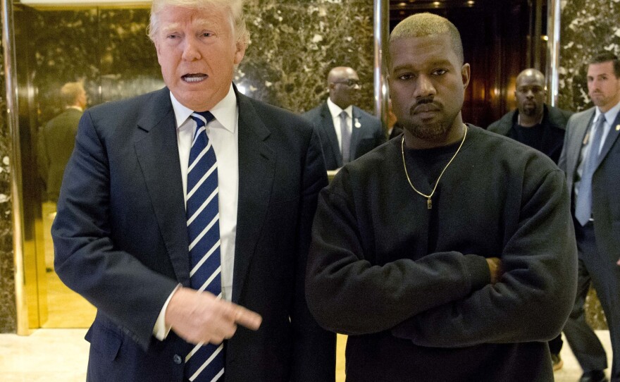 President-elect Donald Trump and Kanye West pose for a picture Tuesday in the lobby of Trump Tower in New York.