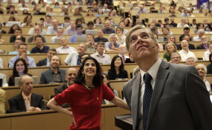 Fabiola Gianotti of the ATLAS group (left) and Joe Incandela of the Compact Muon Spectrometer team announced their findings during a presentation Wednesday in Switzerland.