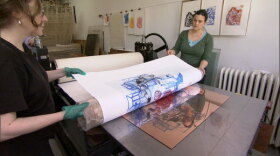 Artists working in a print shop. 