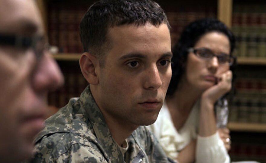 Adam Winfield is seen with his parents during a meeting with the family's defense attorney at Ft. Lewis.
