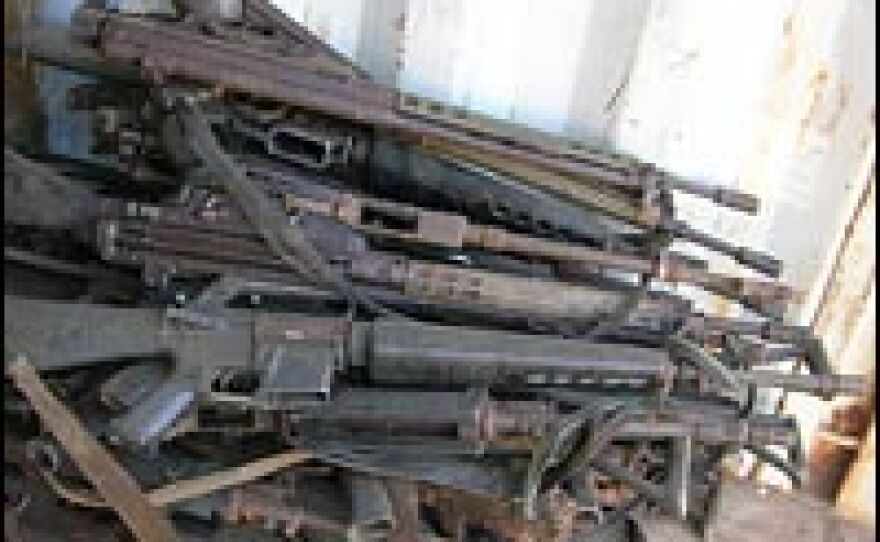 Weapons handed in by former rebels are piled up in Congo, which has been battered by war for years.