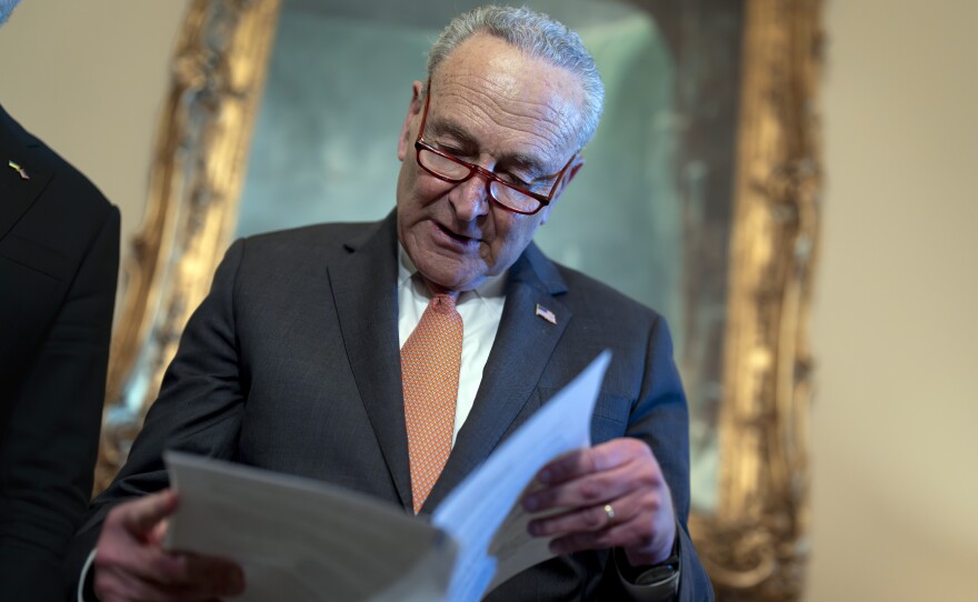 Senate Majority Leader Chuck Schumer, D-N.Y., looks over his notes during a meeting with Ukraine's Prime Minister Denys Shmyhal as Congress moves to advance an emergency foreign aid package for Israel, Ukraine and Taiwan, at the Capitol in Washington, Thursday, April 18, 2024.