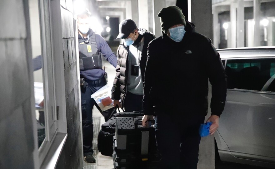 Police officers search addresses in Holbaek, Denmark, on Feb. 6. Denmark's intelligence service said it detained 13 people over a suspected terror plot, with another person arrested in Germany in a "linked" case.