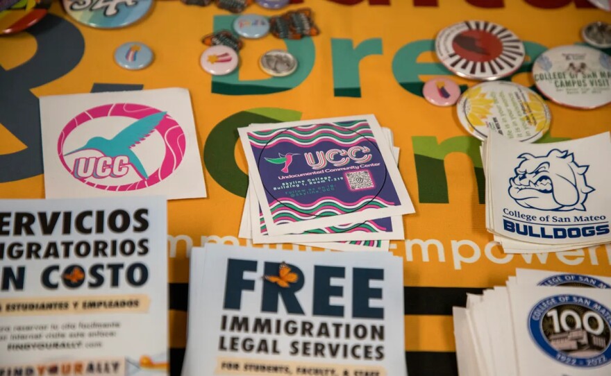 Stickers and flyers on a table in the Undocumented Community Center at the College of San Mateo in San Mateo, on Nov. 28, 2023. At this center, students without legal status can access financial and legal aid as well as guidance in navigating grant applications.