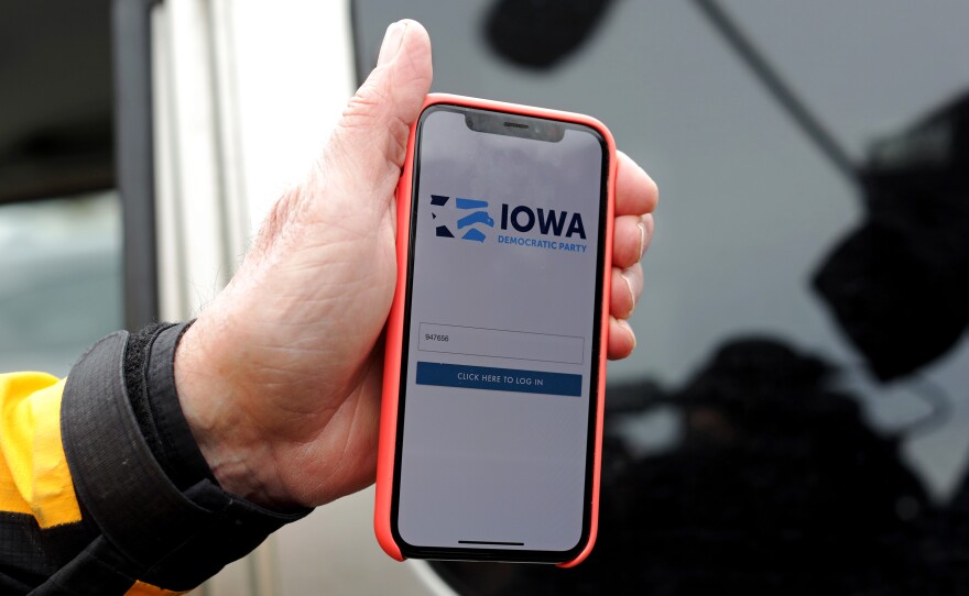 Des Moines City Councilman and a precinct chair Carl Voss shows the app that was used for caucus results reporting on his smartphone after he unsuccessfully attempted to drop off a caucus results packet from Precinct 55 at the Iowa Democratic Party headquarters on Tuesday in Des Moines, Iowa.