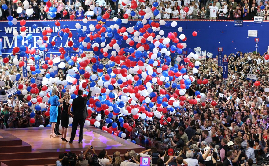 Mitt Romney and vice presidential candidate Paul Ryan are on stage with their wives at the end of the Republican National Convention in Tampa, Fla. in 2012.