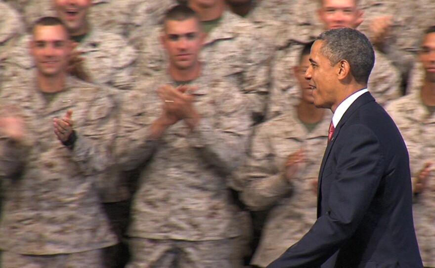 President Barack Obama walks to the podium to address the troops and their families at Marine Corps Base Camp Pendleton on Wednesday, August 7, 2013, during his first visit to the base.