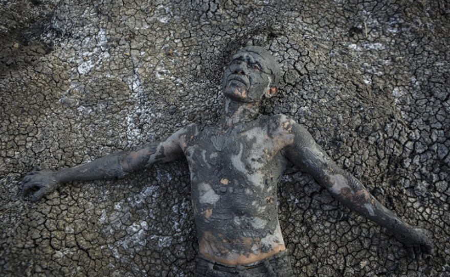 Mud man. An East Java village seeks reparations from the corporation that buried the town in mud.